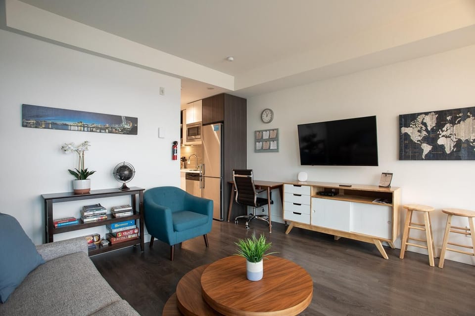 Broad perspective of the main living room, highlighting high ceilings and open layout flow.