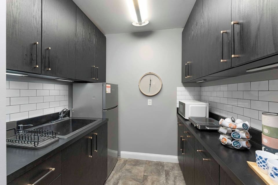 Full kitchen with refrigerator, coffee station and more