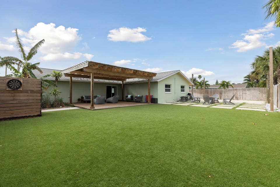 A spacious, green backyard perfect for relaxation and outdoor fun.