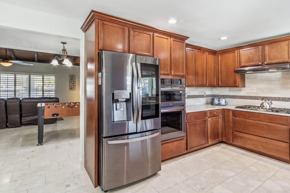 Kitchen is outfitted with stainless steel appliances