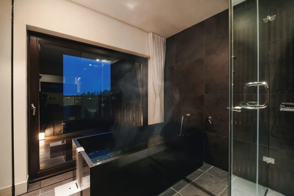 Separate tub and shower, free toiletries, hair dryer, slippers