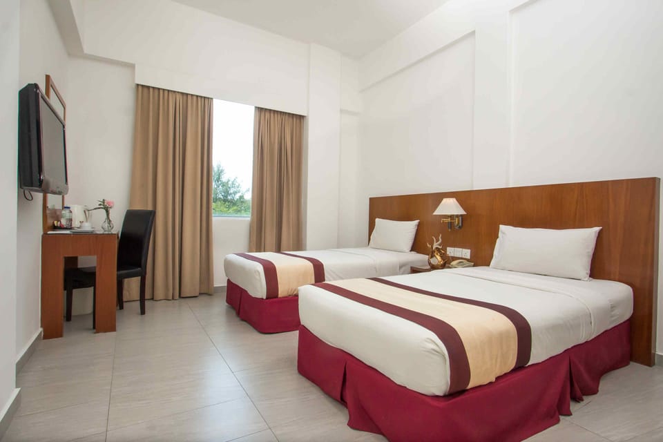 Twin Room, 2 Twin Beds | Blackout drapes, WiFi (free), bed sheets