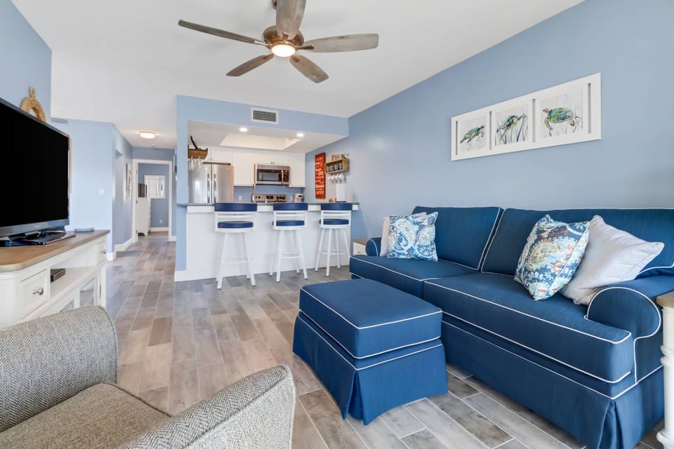 The living room, kitchen and sitting area all easily flow together in the open space.