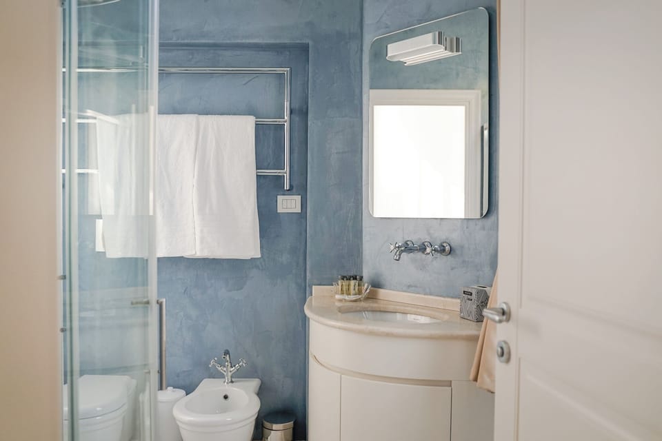 Deluxe Double Room, Park View | Bathroom | Hair dryer, slippers, towels, soap