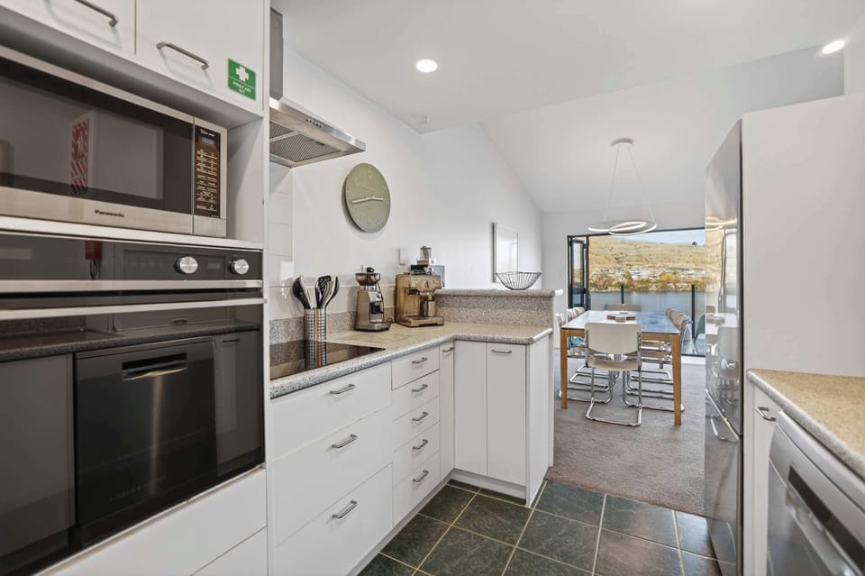 Kitchen with amenities including espresso maker, coffee grinder and coffee beans from local coffee roaster Black Lab Coffee