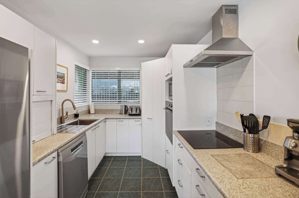 Kitchen with amenities including espresso maker, coffee grinder and coffee beans from local coffee roaster Black Lab Coffee