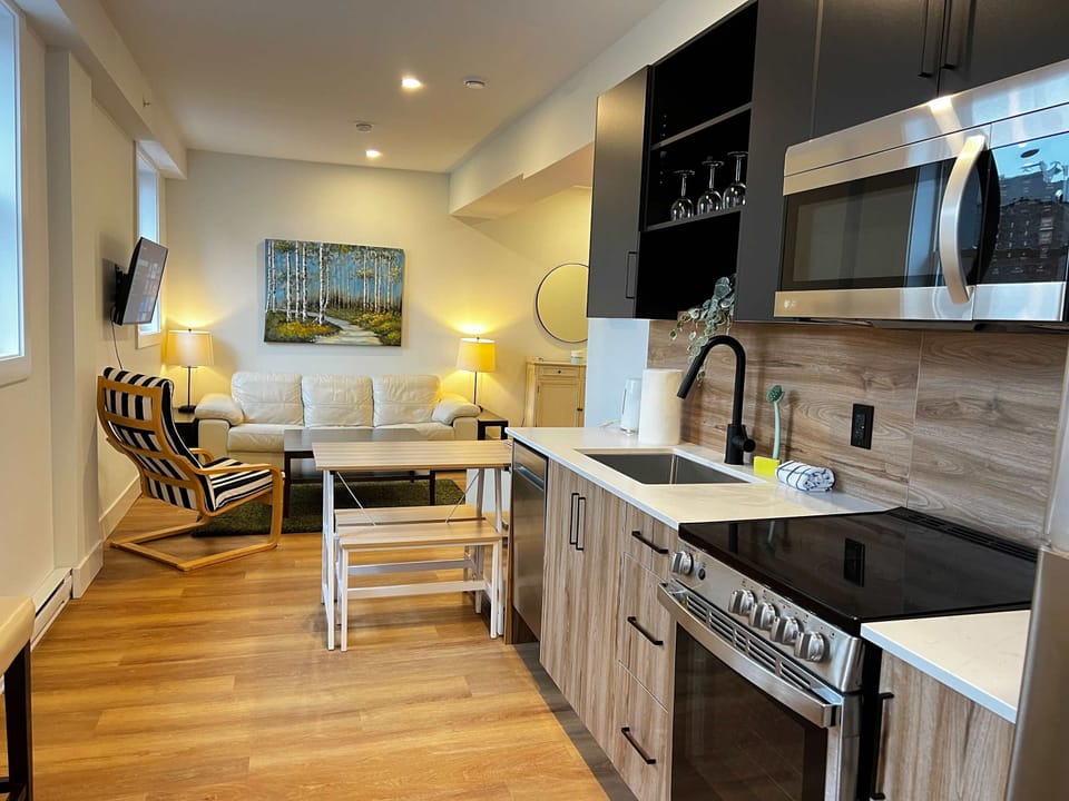 Stylish open-plan kitchen with full amenities and a separate dining zone.