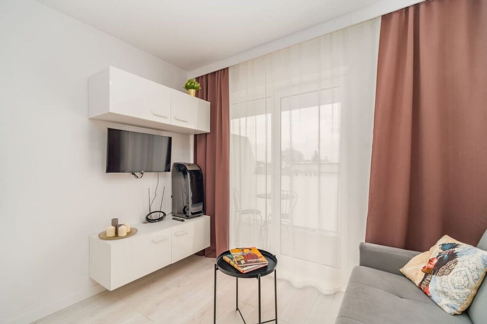 Living Area with Sofa Bed and TV | Book Now with RENTUJEMY.COM