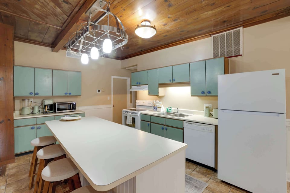 Kitchen with drip coffee, blinder, microwave, can opener and toaster 