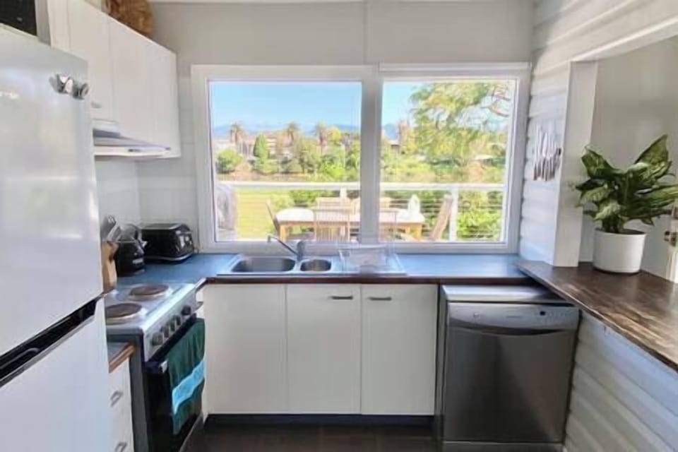 Cooking with a river view! Full-size oven, refrigerator & dishwasher