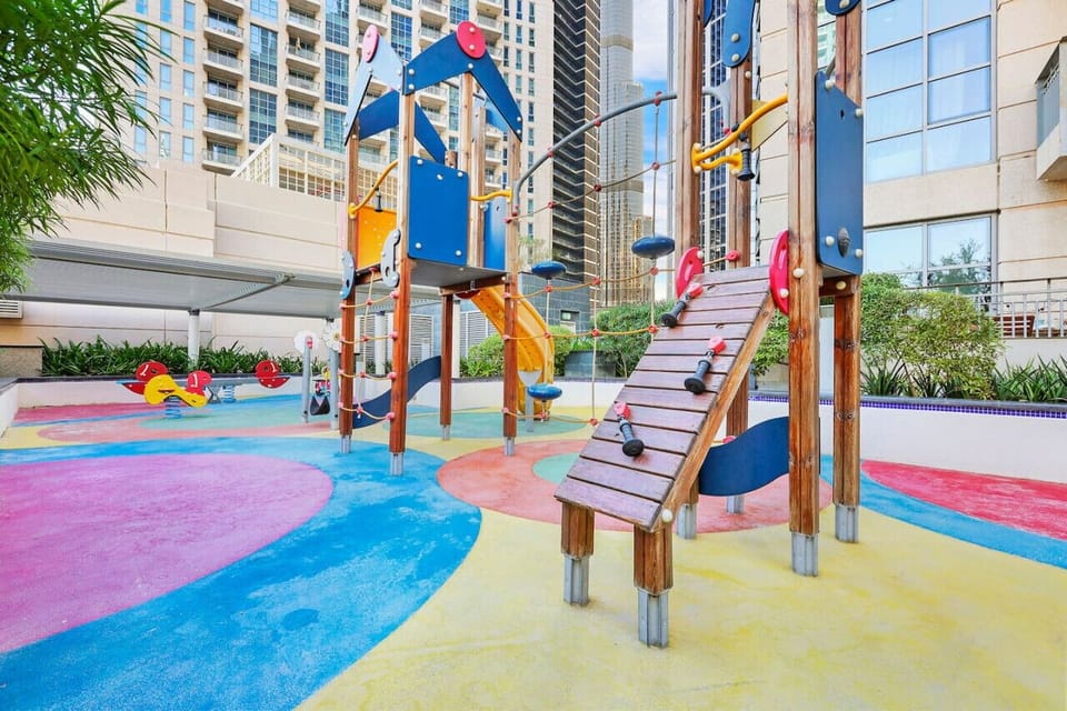 Play Area: Fun-filled playground for kids, vibrant colors, and exciting equipment await!
