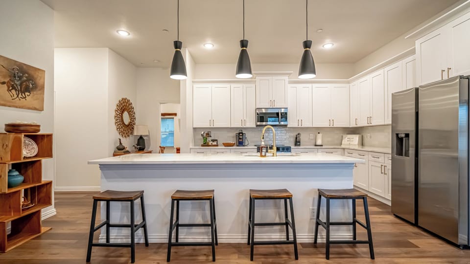  A fully equipped chef's kitchen with everything you need for a home-cooked meal or game day prep. Full-size appliances, cookware, utensils, and counter space to spare — because not every great meal should come from DoorDash.