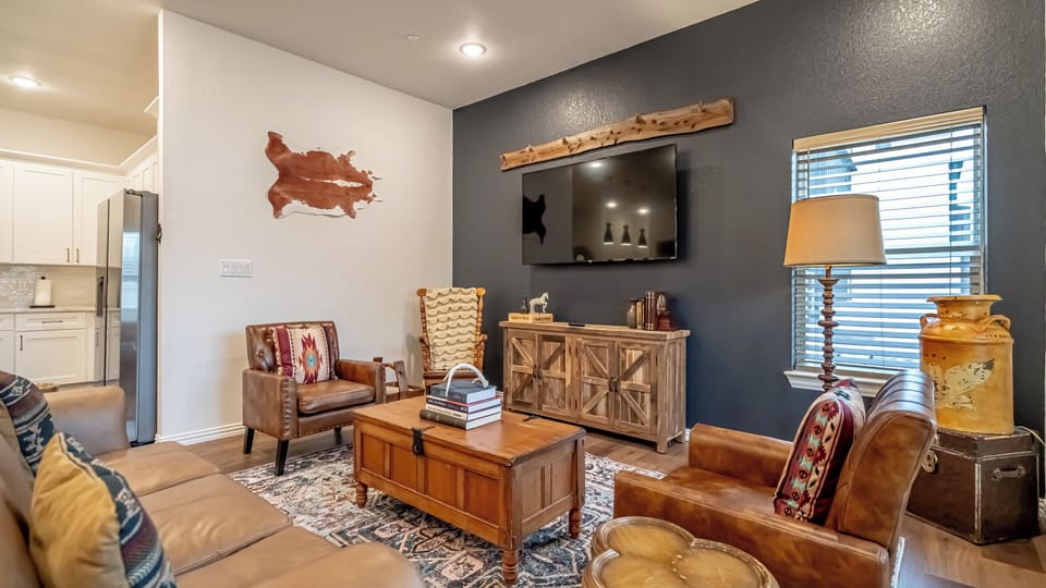Kick back in a stylish, open-concept living space designed for comfort and connection. Whether you're debriefing after a Rangers game, watching pre-game coverage on the smart TV or just relaxing with your crew—The Ryan's living area has you covered.