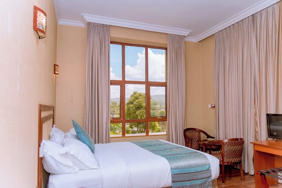 Deluxe Single Room, City View | In-room safe, desk, laptop workspace, blackout drapes