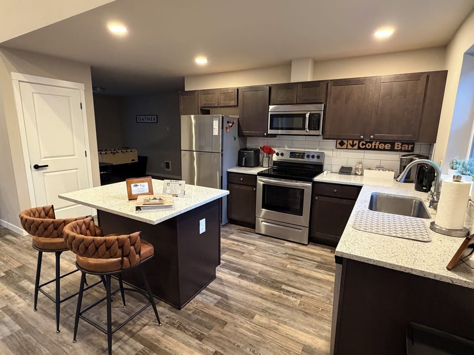 Kitchen ready for you — well-stocked, cozy, and even includes an air fryer for easy meals.