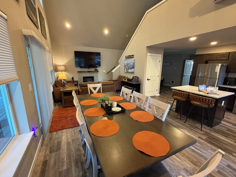 Big table, full hearts — enjoy meals together with plenty of space for everyone (and we have a Bumbo seat for the littlest guest).