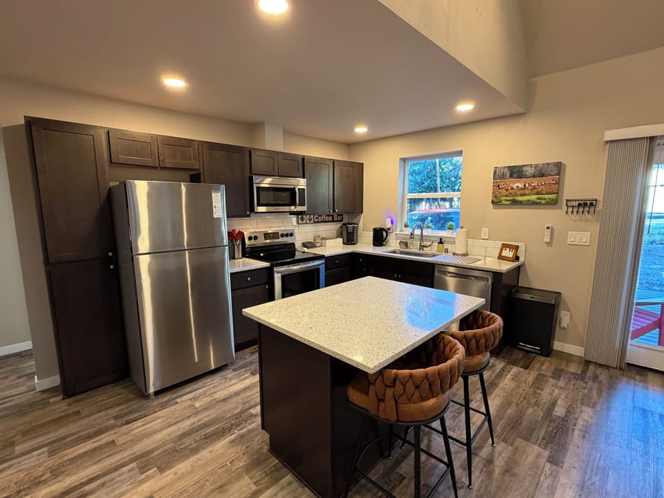 Kitchen ready for you — well-stocked, cozy, and even includes an air fryer for easy meals.