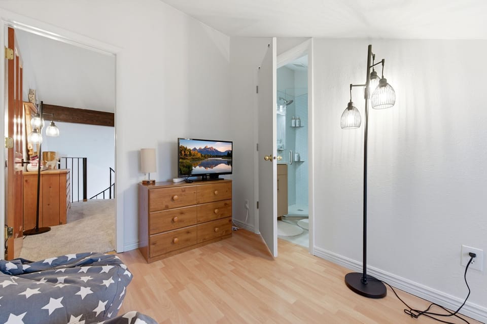 The door leads to the second bathroom