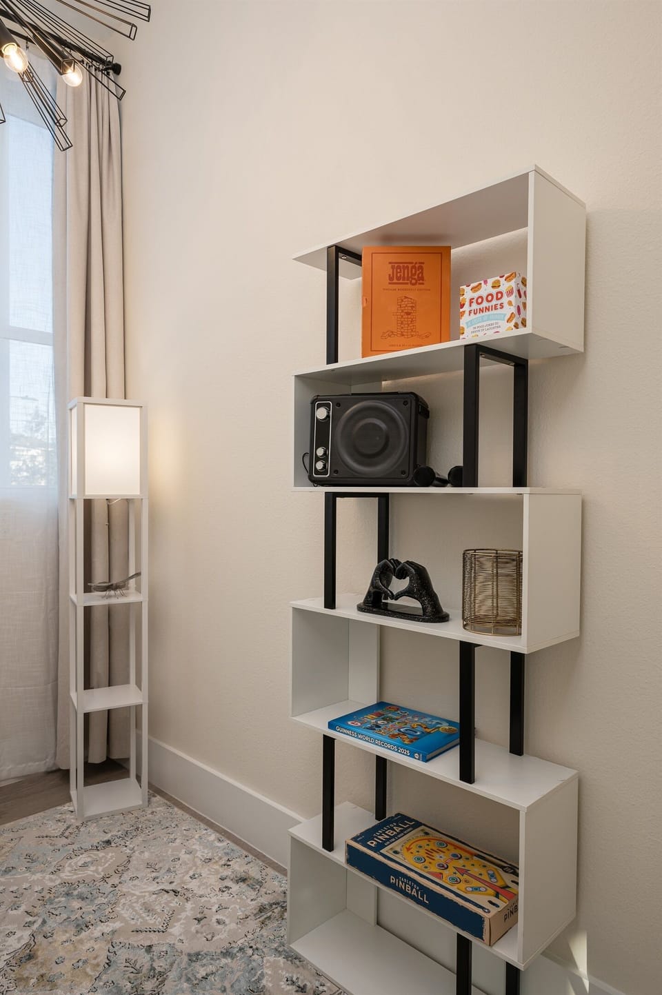 This home office features a comfortable chair, a desk, and plenty of natural light.