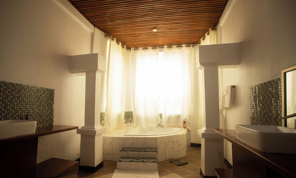Presidential Double Room, Ocean View | Bathroom | Separate tub and shower, bathrobes, towels, soap