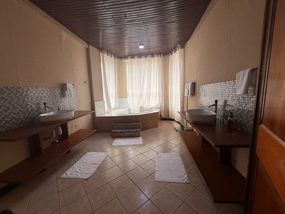 Presidential Double Room, Ocean View | Bathroom | Separate tub and shower, bathrobes, towels, soap