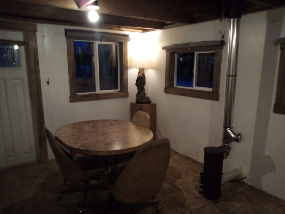 The dining area with fuel oil furnace. 