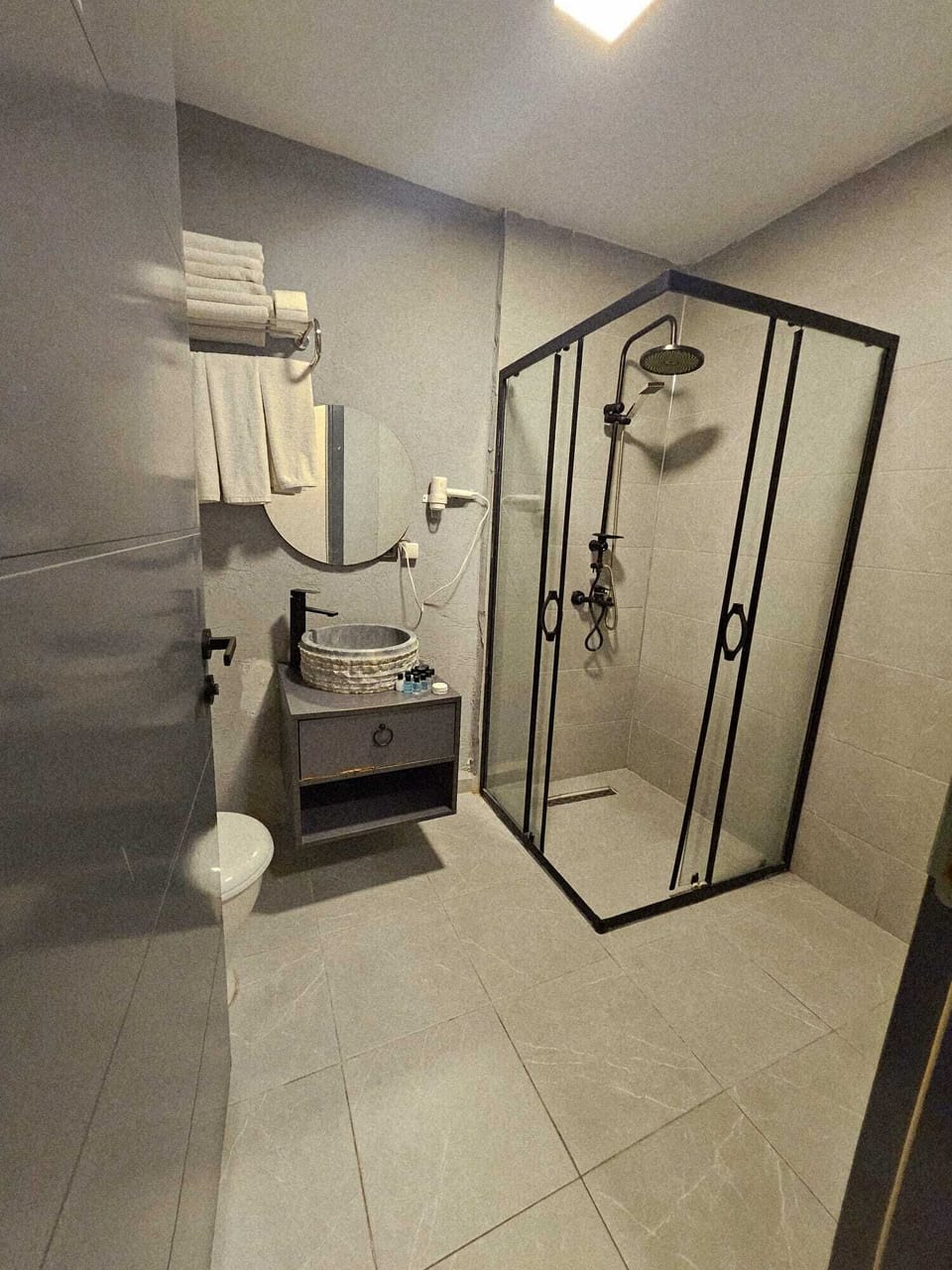 Shower, free toiletries, hair dryer, slippers