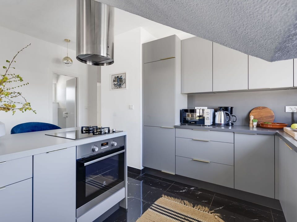Kitchen, Kitchen Appliance, Countertop, Cabinetry, Interior Design, Major Appliance, Furniture, Flooring, Home Appliance, Ceiling