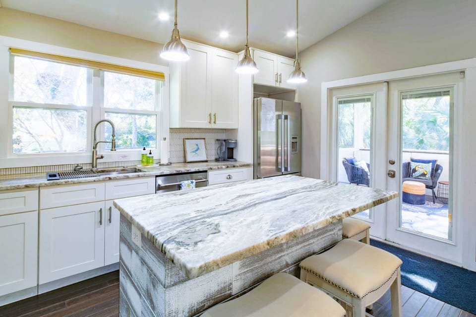 Waterway Oasis also features a gorgeous kitchen with a central island and stainless steel appliances.
