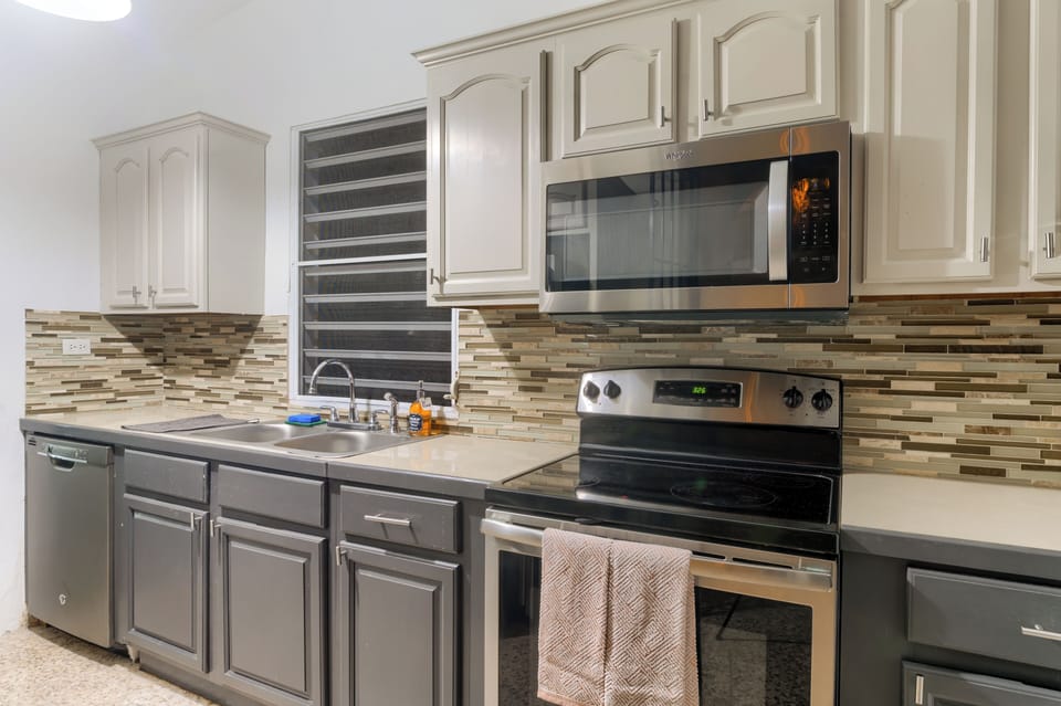 Enjoy a complete electric range, refrigerator, and dishwasher; you have everything you need for meal preparation. Ample counter space provides room for cooking and gathering, making it ideal for family meals or dinner parties.
