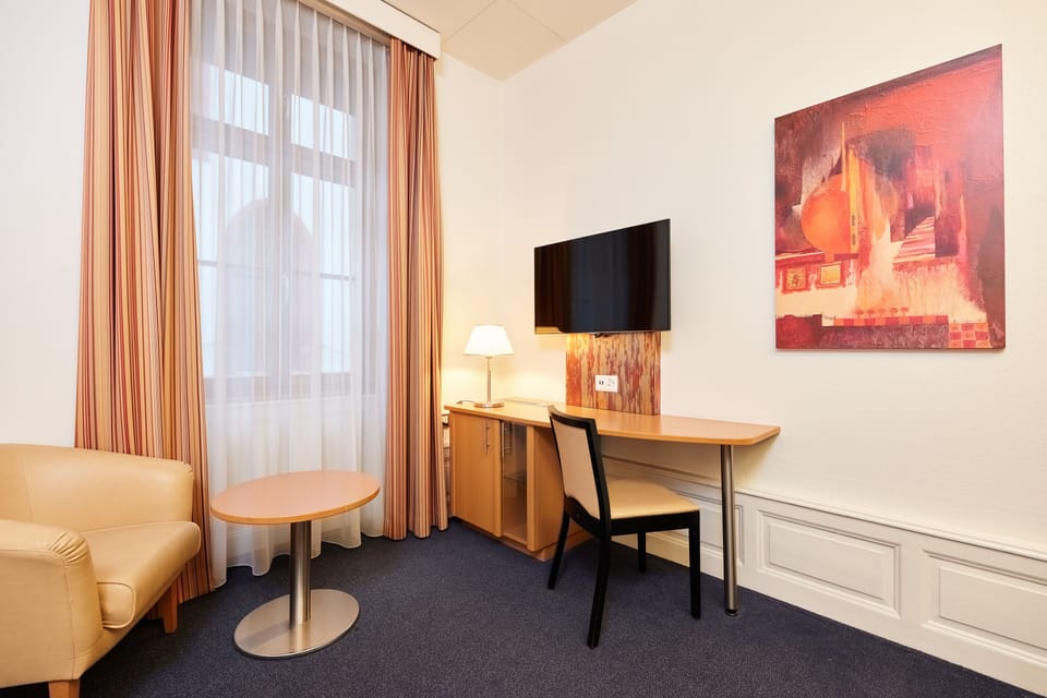 Twin Room | Minibar, in-room safe, desk, blackout drapes