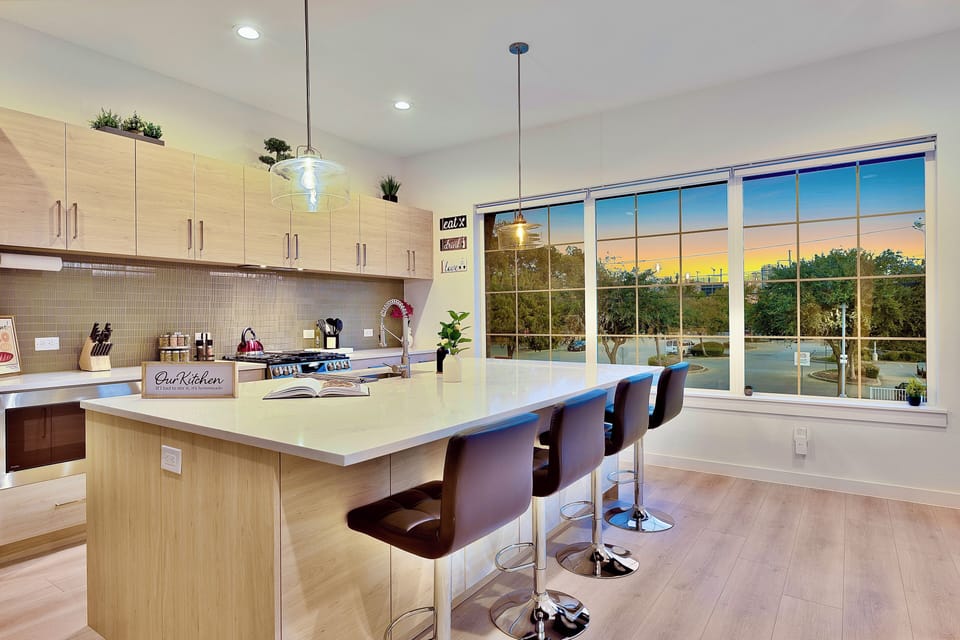 Modern Kitchen with large window to view Dallas Downtown