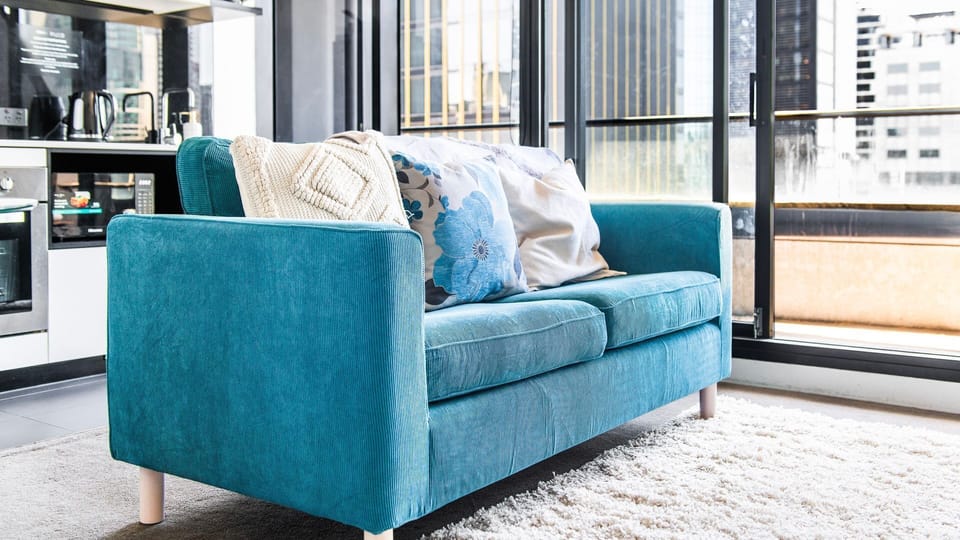 Cozy sofa with natural light and city outlook