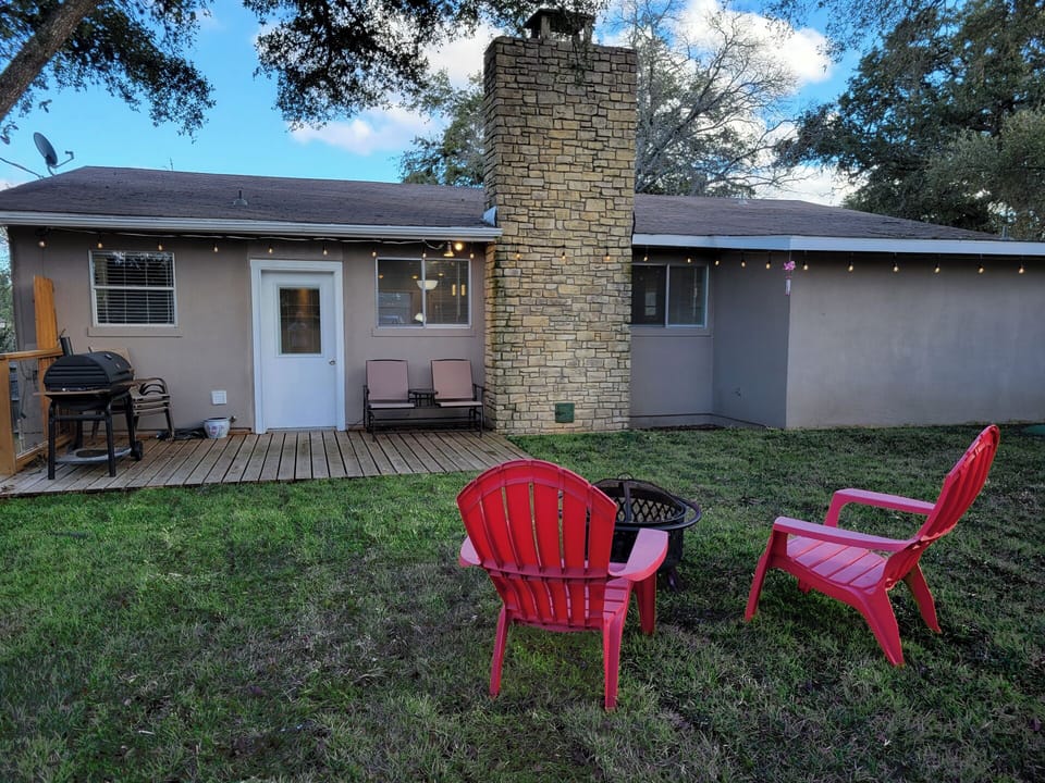 The backyard has plenty of space for relaxing or other activities.