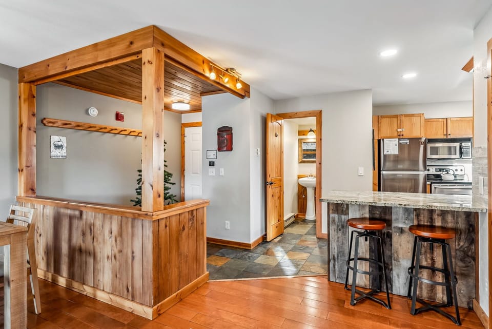 Entry opens into kitchen area and powder room