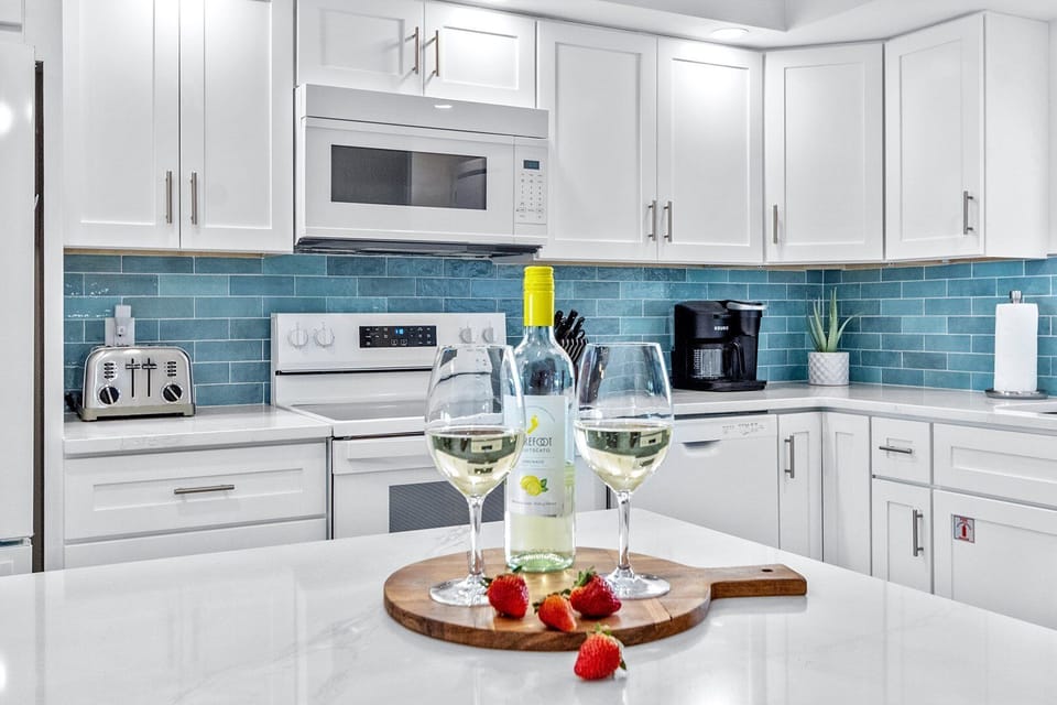 Chic kitchen setup with a pop of blue and a touch of elegance