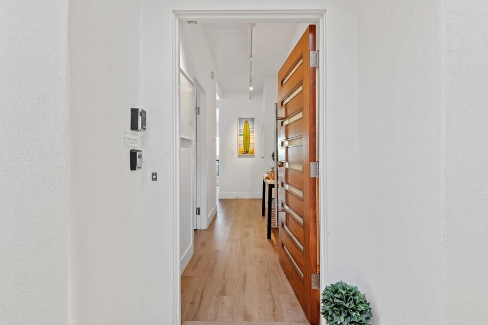 Upper: Front door of Beachfront Bliss