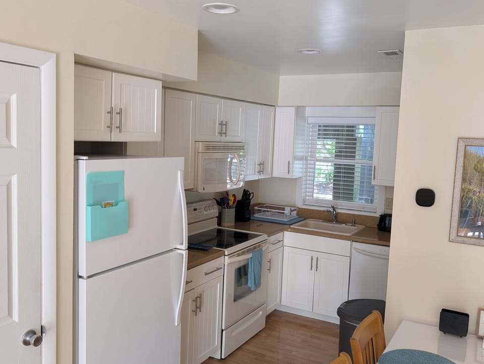 Kitchen with utensils, pots, pans, dish soap, some basic spices, etc