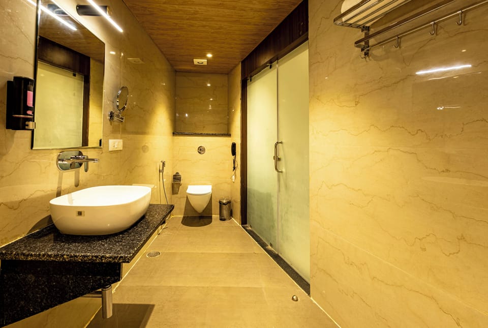 Family Suite, City View | Bathroom | Bathrobes, slippers, towels, soap