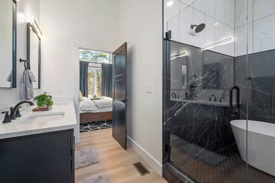 With a shower & stand-alone tub