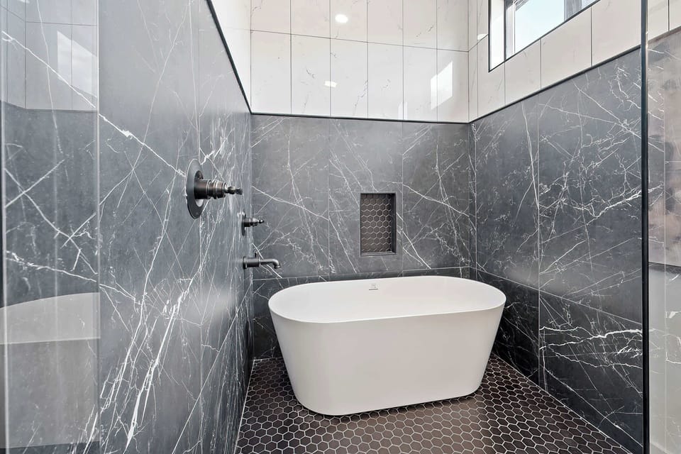 With a shower & stand-alone tub