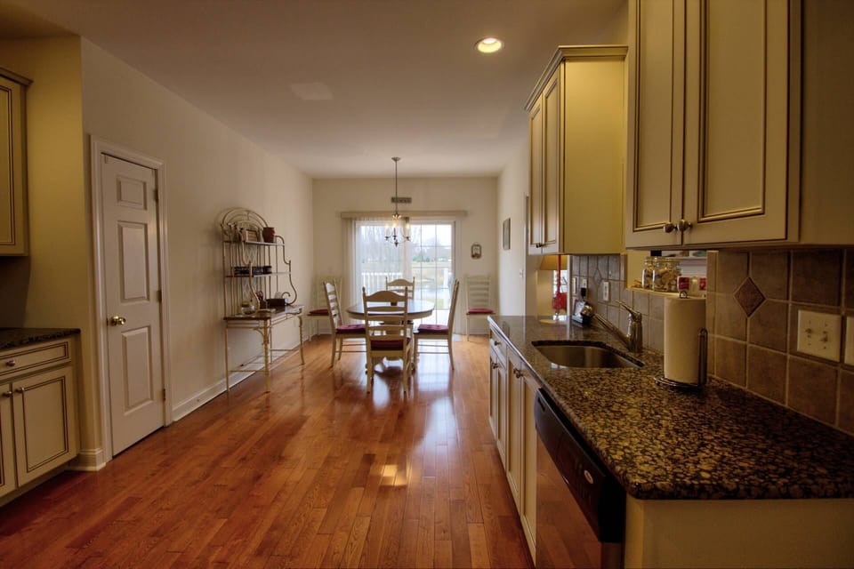 Kitchen with dining area overlooking the rear deck.