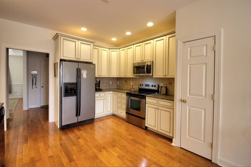 Modern kitchen with essentials, including K-cup and drip coffee pots.