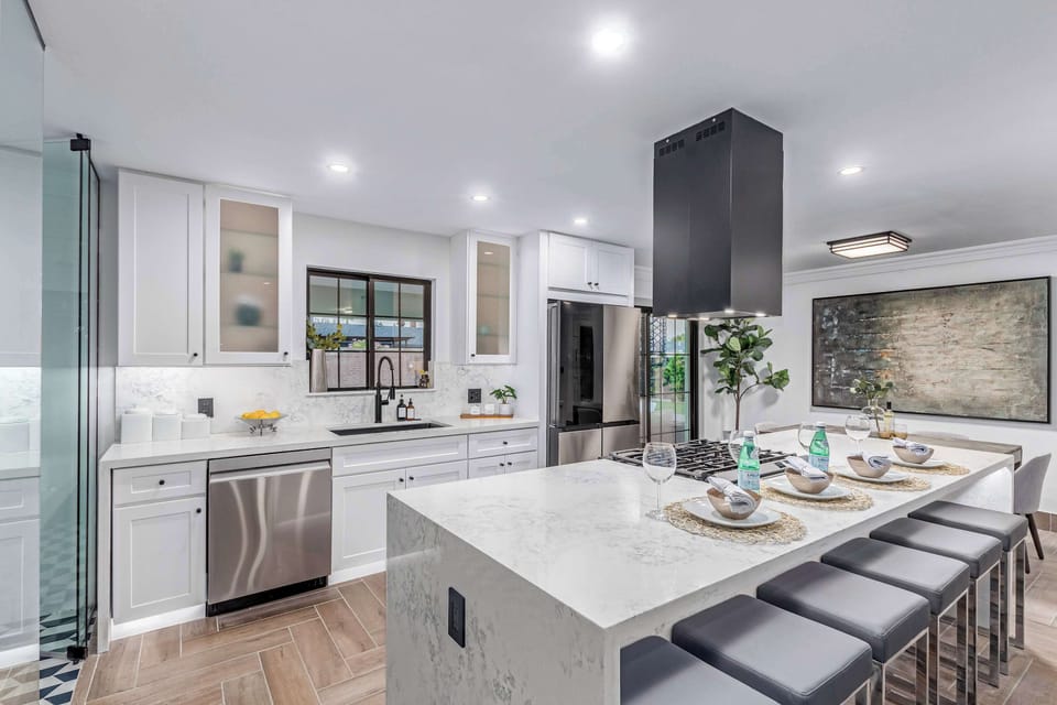 Updated kitchen with stainless steel appliances and gas cooktop