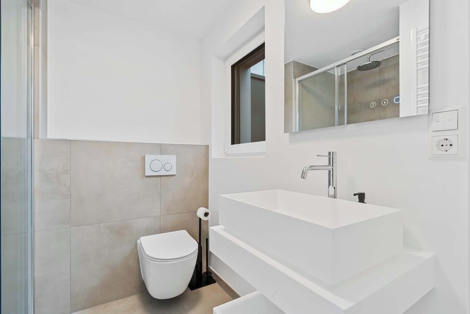  Sleek Bathroom with Walk-In Shower – Enjoy a fresh and modern space designed for ultimate relaxation.