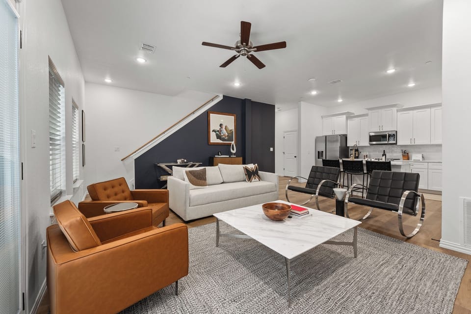Kick back in a stylish, open-concept living space designed for comfort and connection. Whether you're debriefing after a Rangers game, watching pre-game coverage on the smart TV, or just relaxing with your crew—The Ryan's living area has you covered.