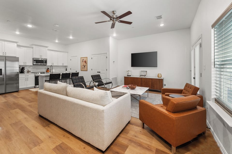 Kick back in a stylish, open-concept living space designed for comfort and connection. Whether you're debriefing after a Rangers game, watching pre-game coverage on the smart TV, or just relaxing with your crew—The Ryan's living area has you covered.