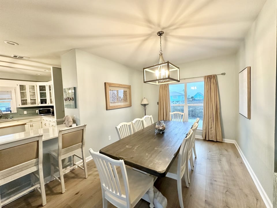Formal dining with bar area open to kitchen 