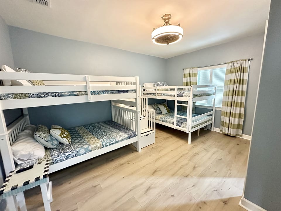 Bunk room second floor with two queen over queen bunk beds and attached bathroom 
