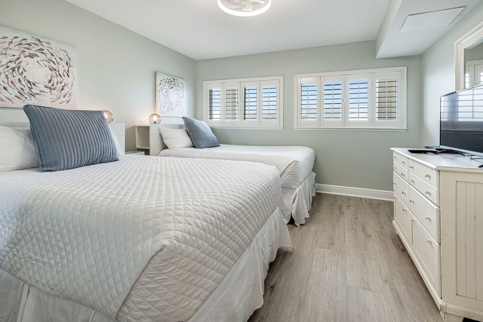 guest suite with two full beds